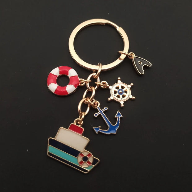 Creative Ocean Keychain – A-Z Letter Keychain with Enamel Anchor, Ship Steering Wheel, and Ship Model Pendant
